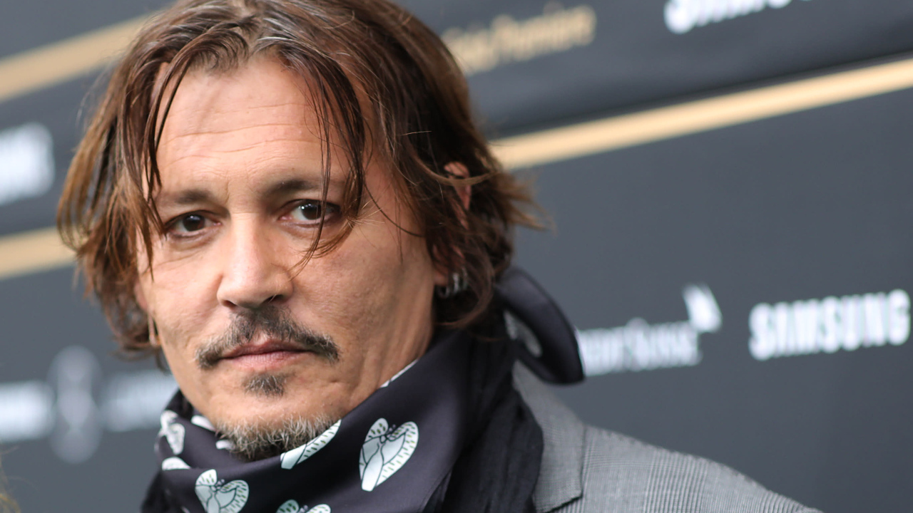 Actor Johnny Depp with a scarf around his neck