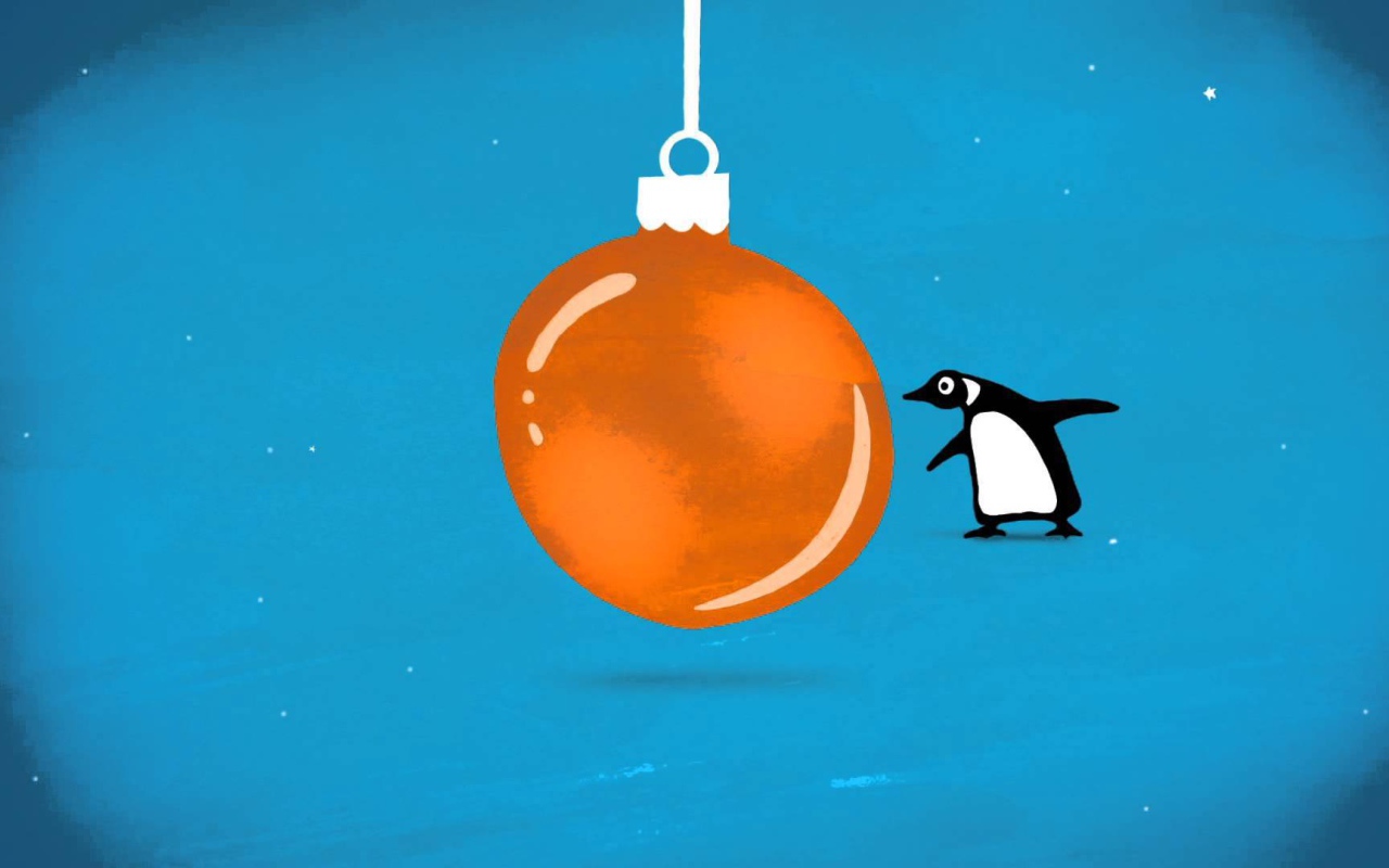 Пингвин и оранжевая ёлочная игрушка на рождество