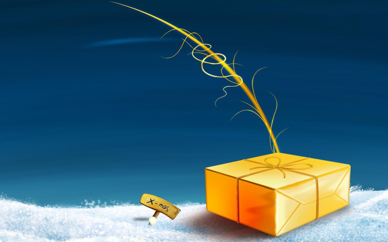 Жёлтая подарочная коробка лежит на снегу на рождество