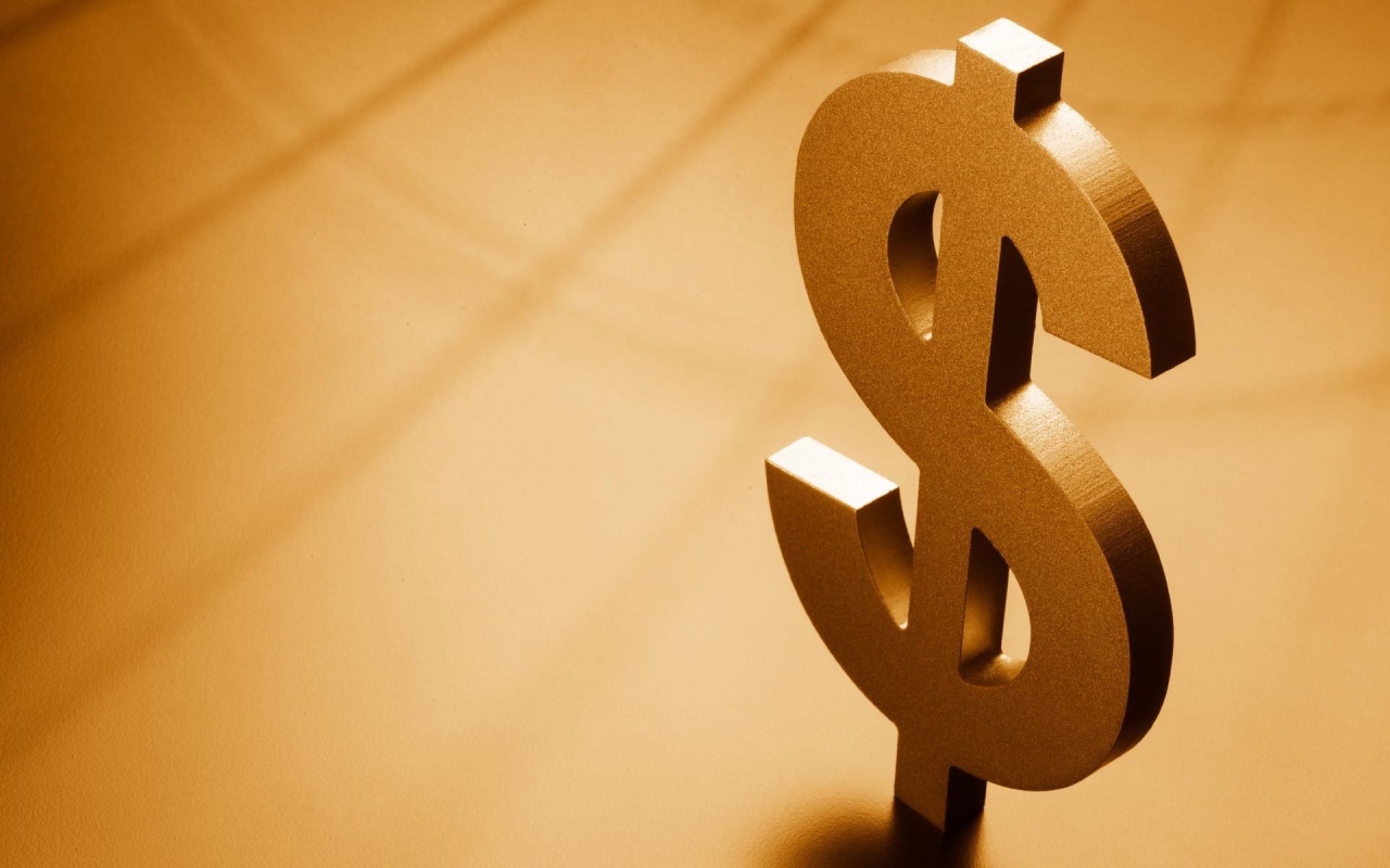 Металлический знак доллара