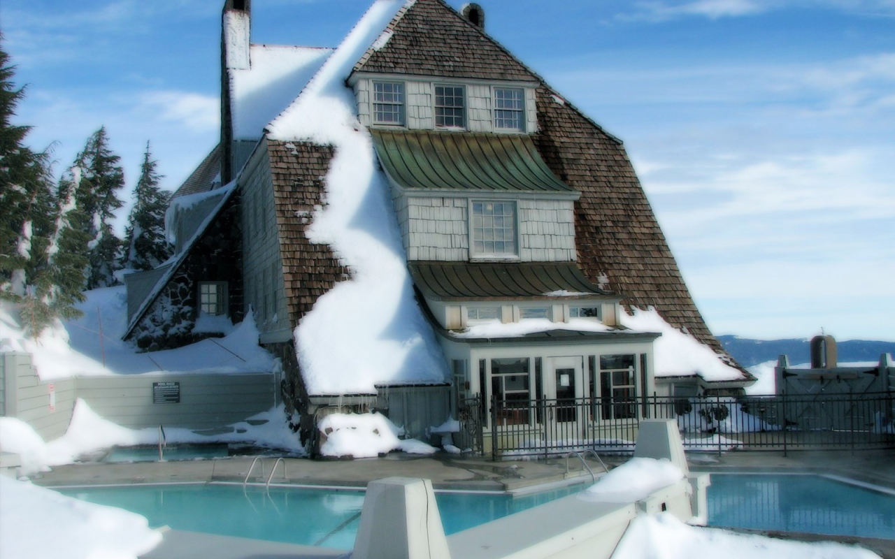	   Snow-covered house with swimming pool