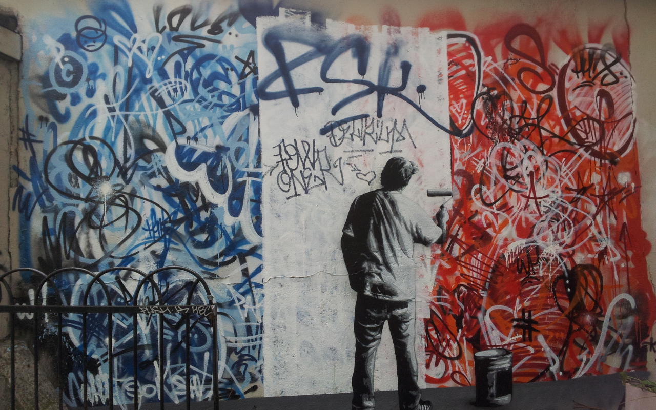 Уличный художник нарисован на стене