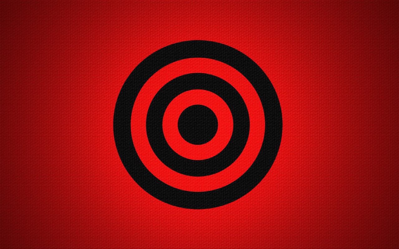 Черная мишень на красном фоне