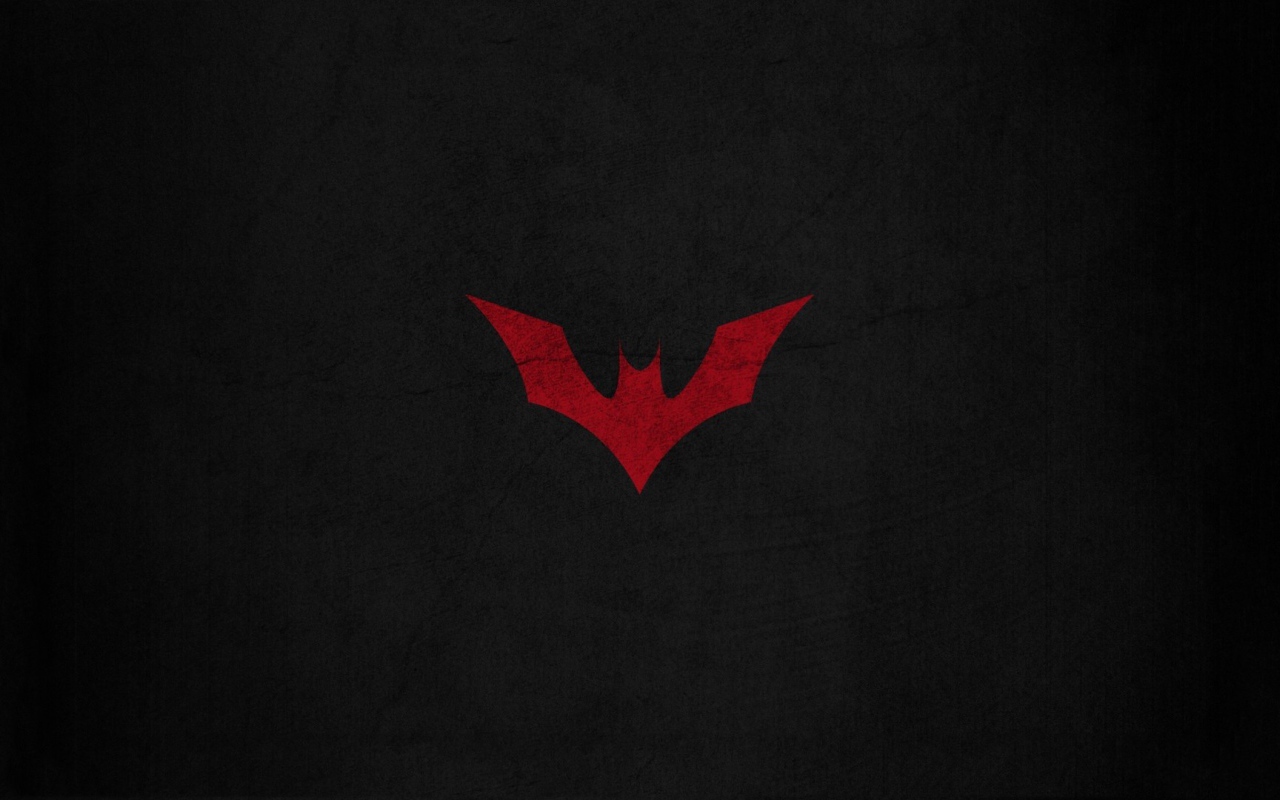 Красная летучая мышь на черном фоне