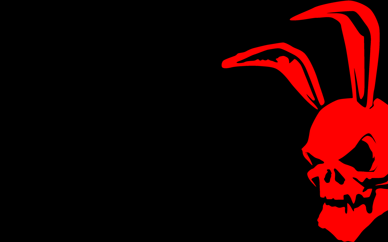 Красный череп с заячьими ушами на черном фоне