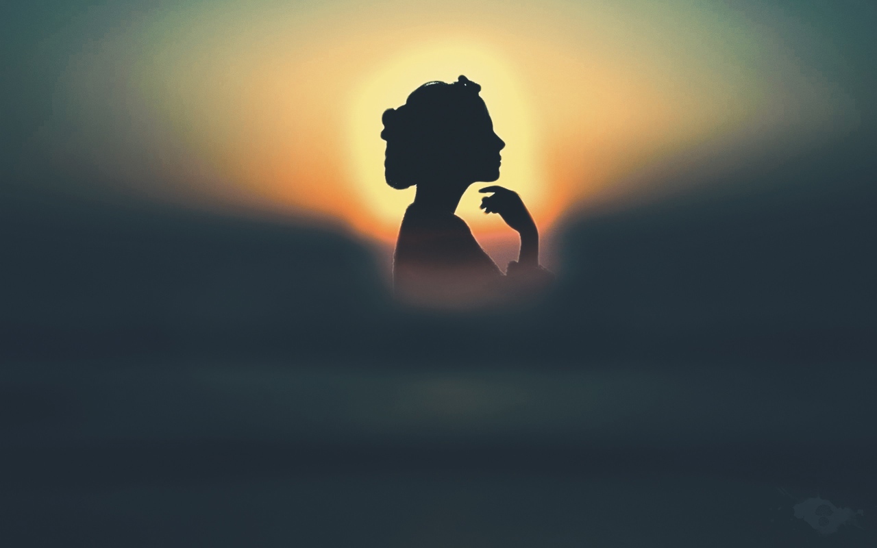 Silhouette of a girl in the sun