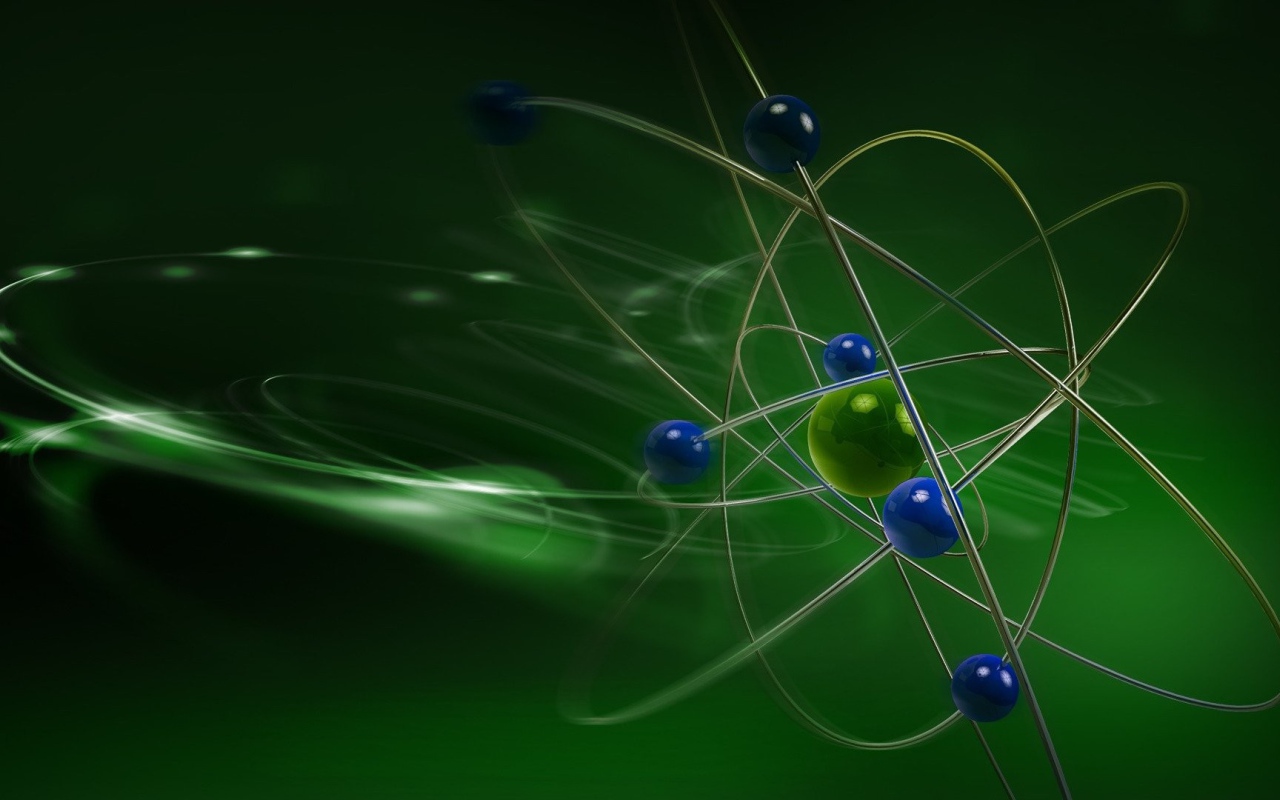 Модель атома на зеленом фоне