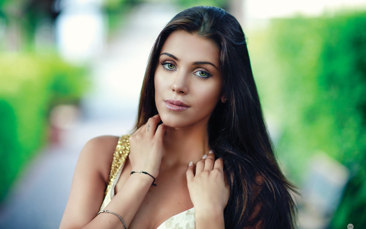 Green-eyed brunette with long hair, portrait