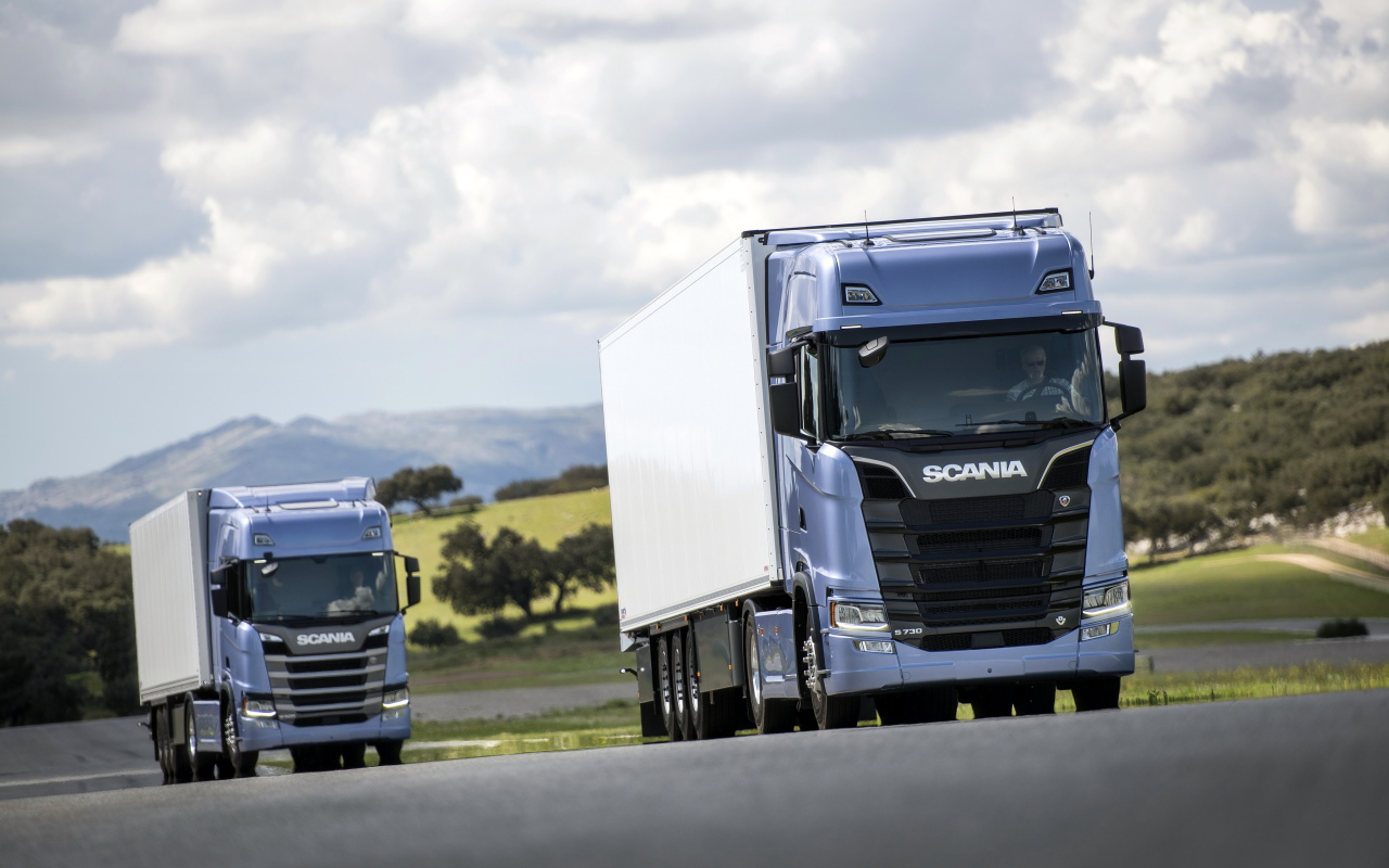Two blue Scania S 700 trucks on the track