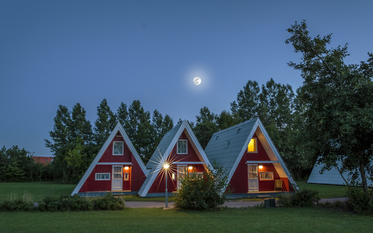 Unusual triangular houses under the night sky, Germany