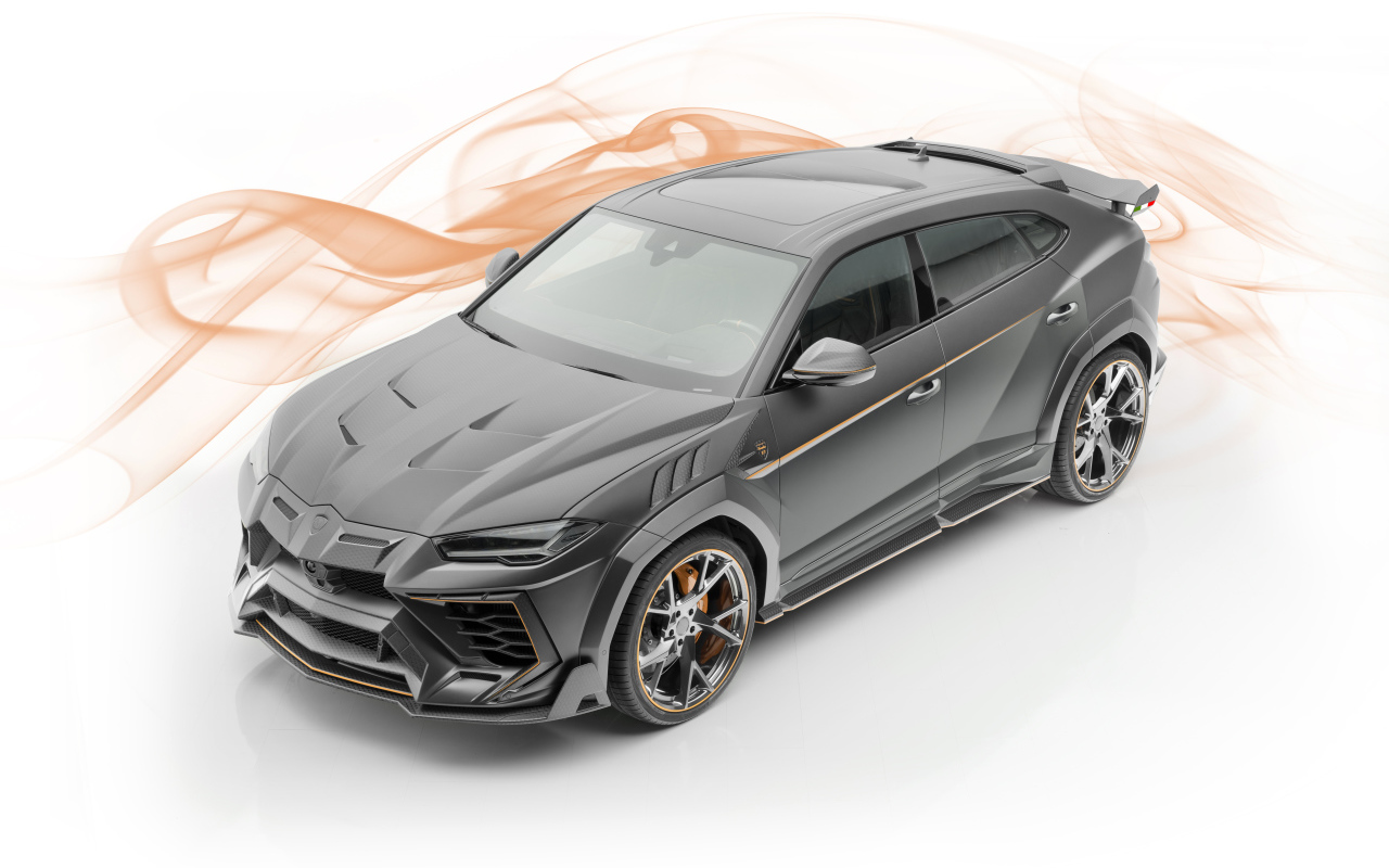 Серебристый автомобиль Lamborghini  Mansory Urus, 2019 года на белом фоне