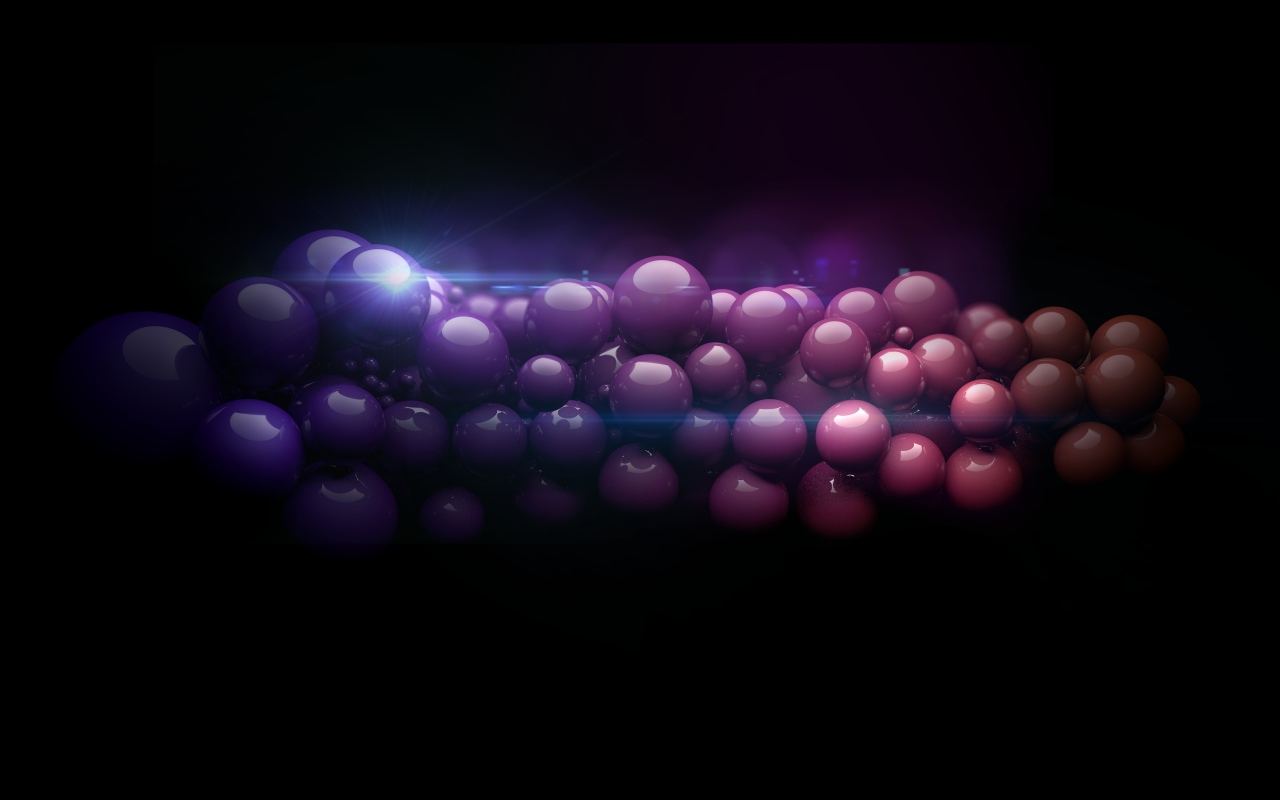 A thread of colorful balls on a black background