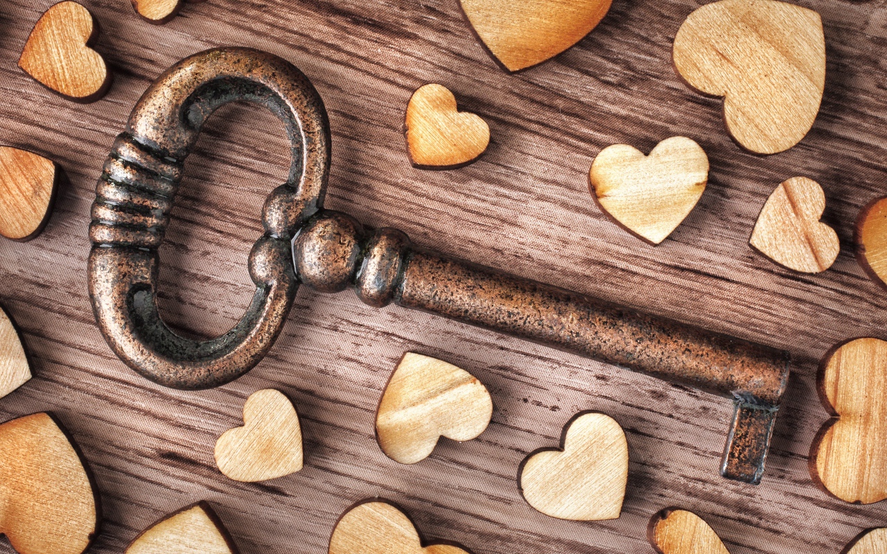 Large iron key with wooden hearts