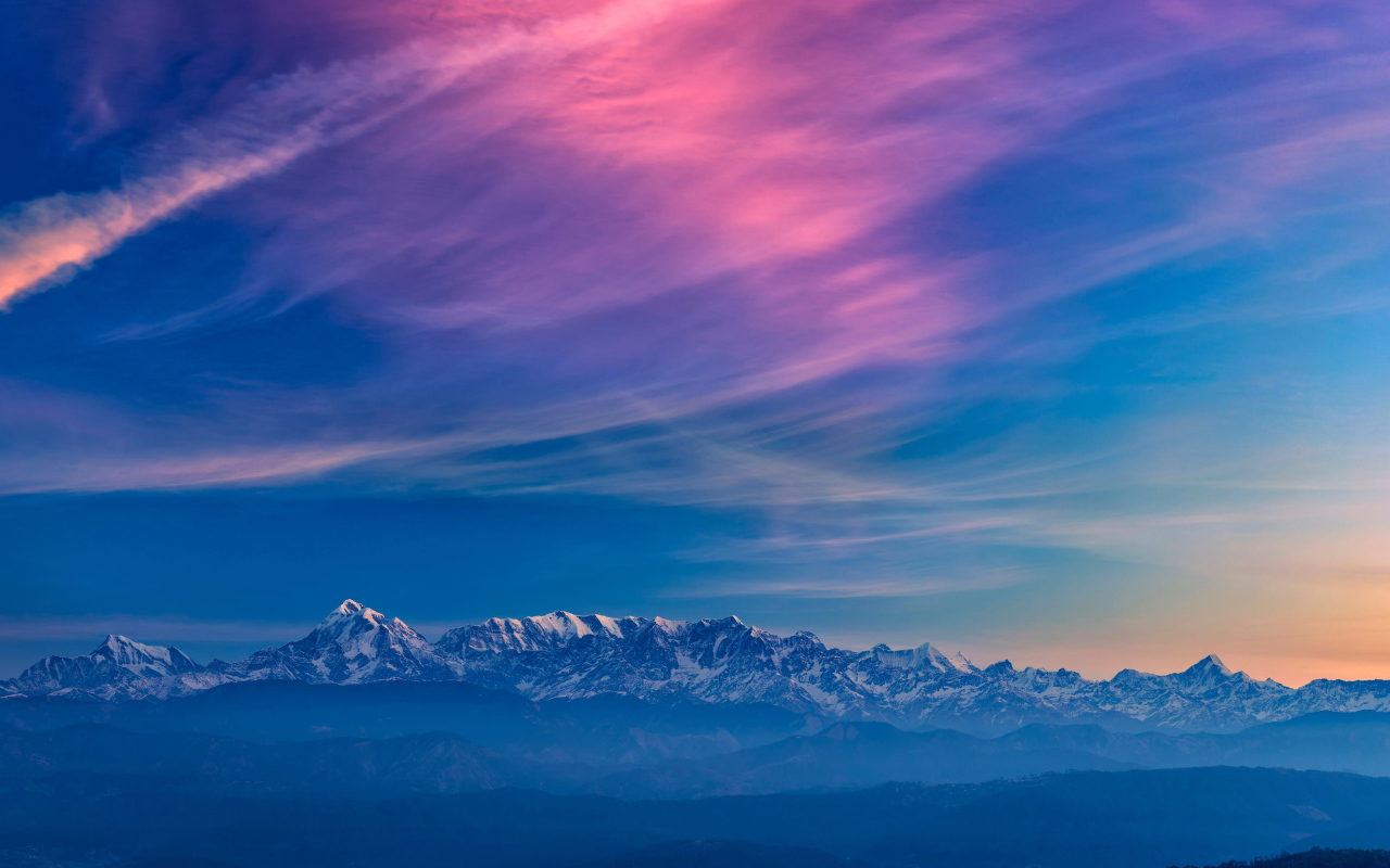 Beautiful sky over snow-capped mountains
