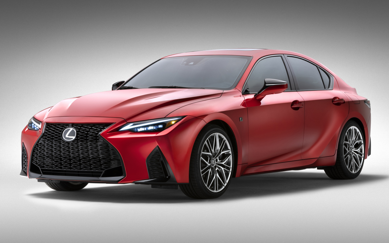 Красный Lexus IS 500 F SPORT Performance, 2022 года на сером фоне