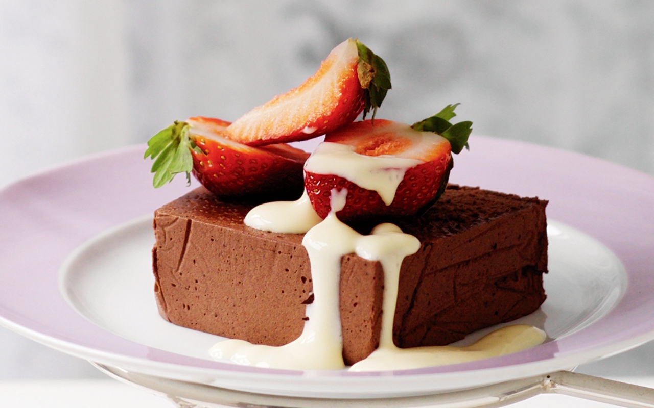 Chocolate soufflé with strawberries on a plate