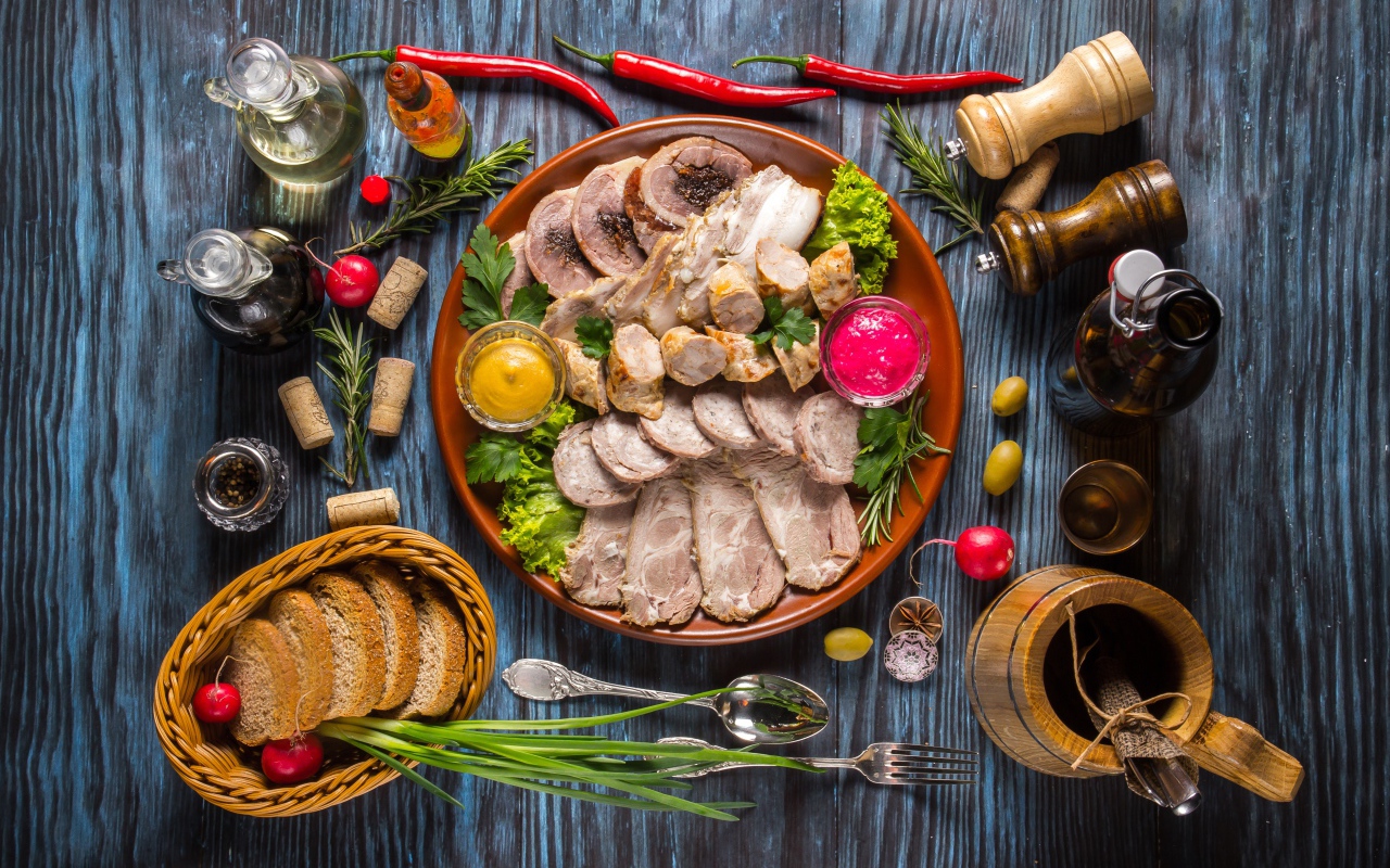 Appetizing cold cuts on the table with spices and bread