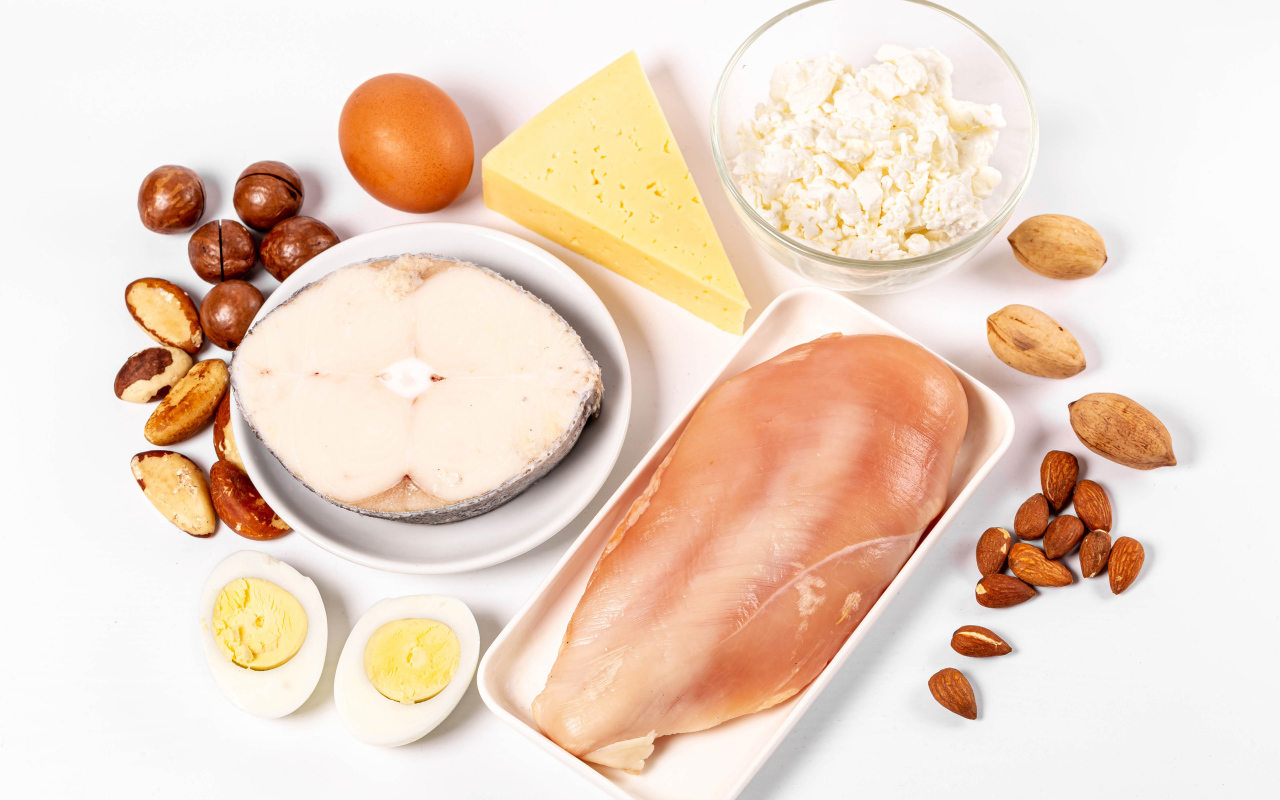 Fresh chicken, fish, nuts, cottage cheese and eggs on the table