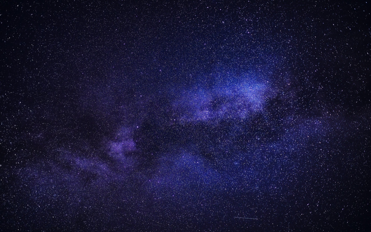 Milky way and stars in the blue night sky