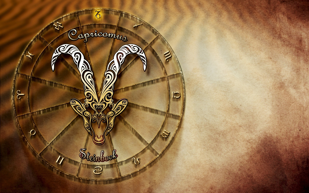 Зодиакальный знак козерог на оранжевом фоне