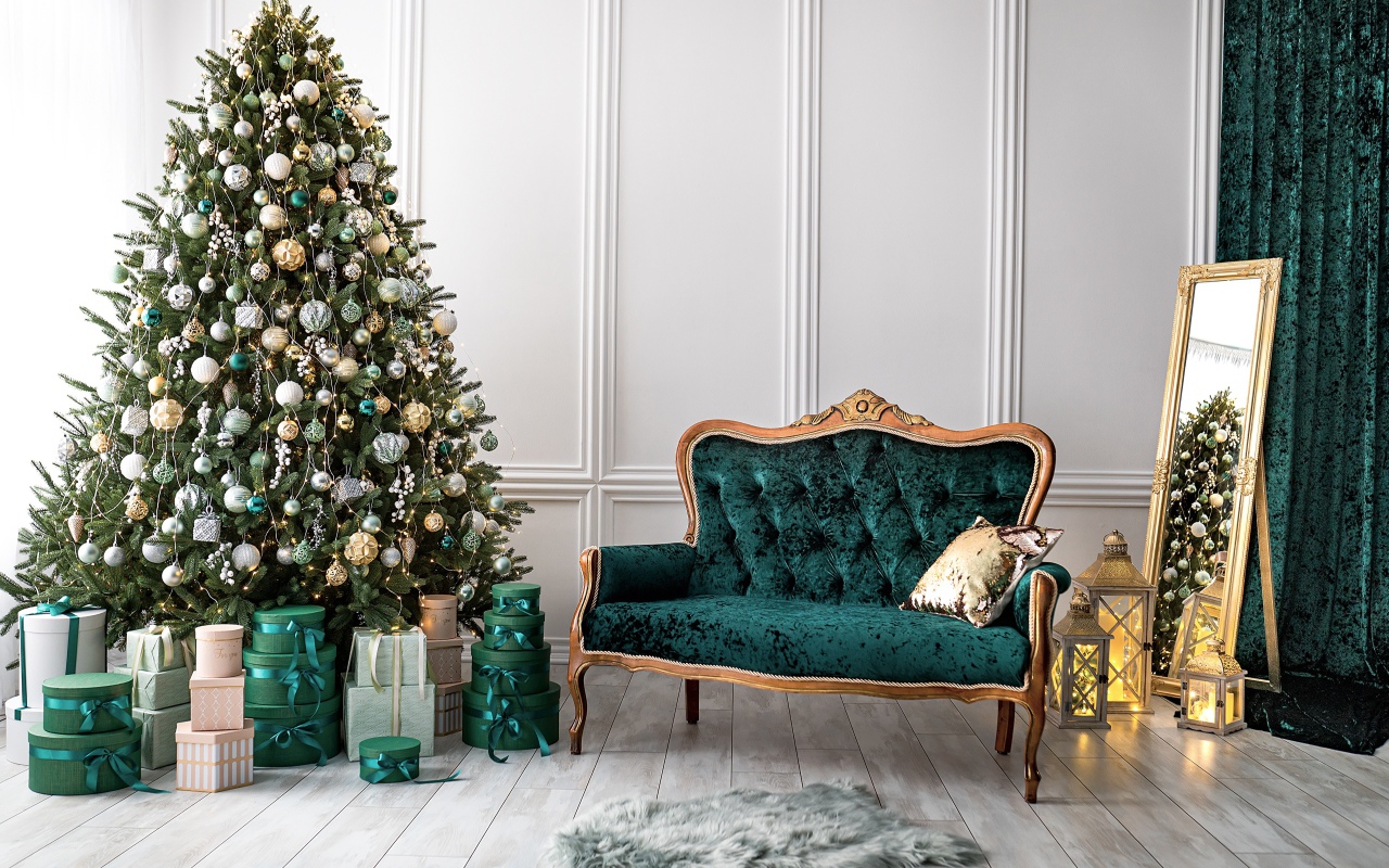 Beautiful decorated fir tree with gifts in a room with a sofa