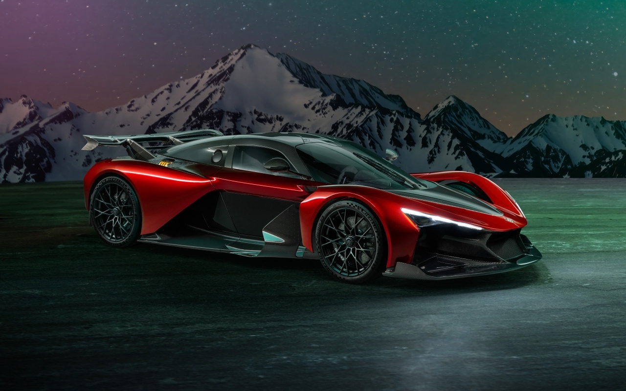 Красный спорткар Zenvo Aurora Agil  на фоне гор