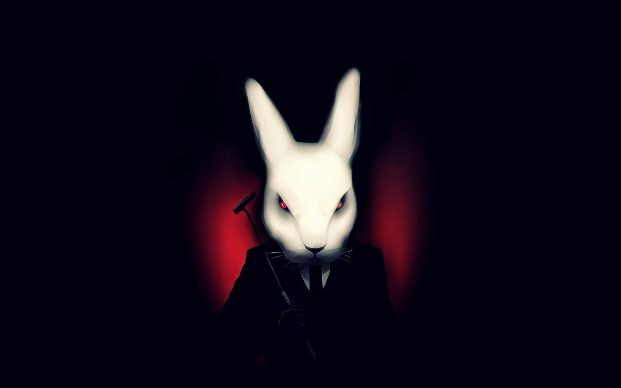 Белый кролик в костюме на черном фоне