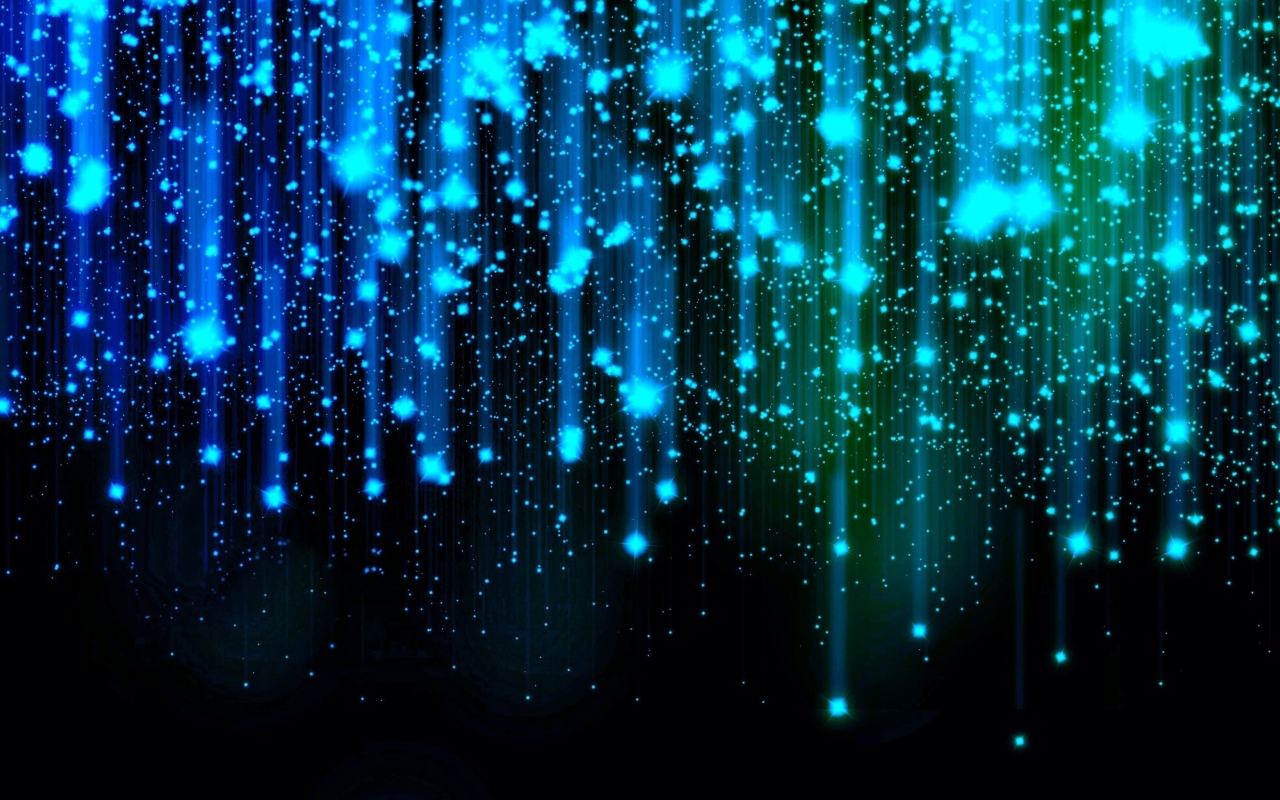 Яркие искры летят вниз на черном фоне