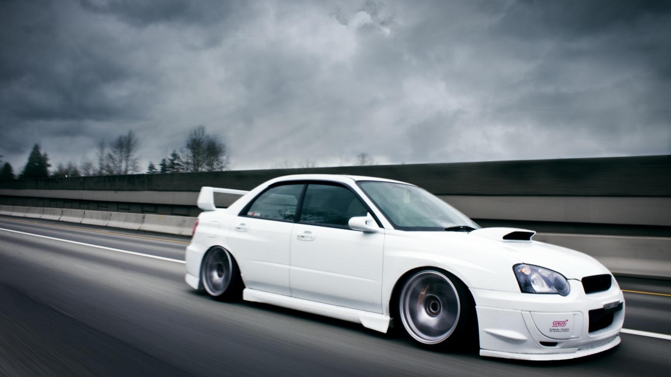 white Subaru Impreza STI