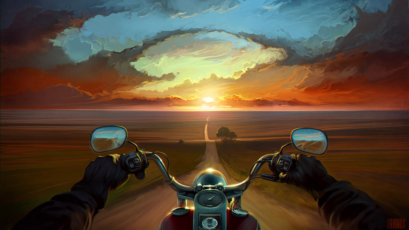 Мотоциклист едет на закат