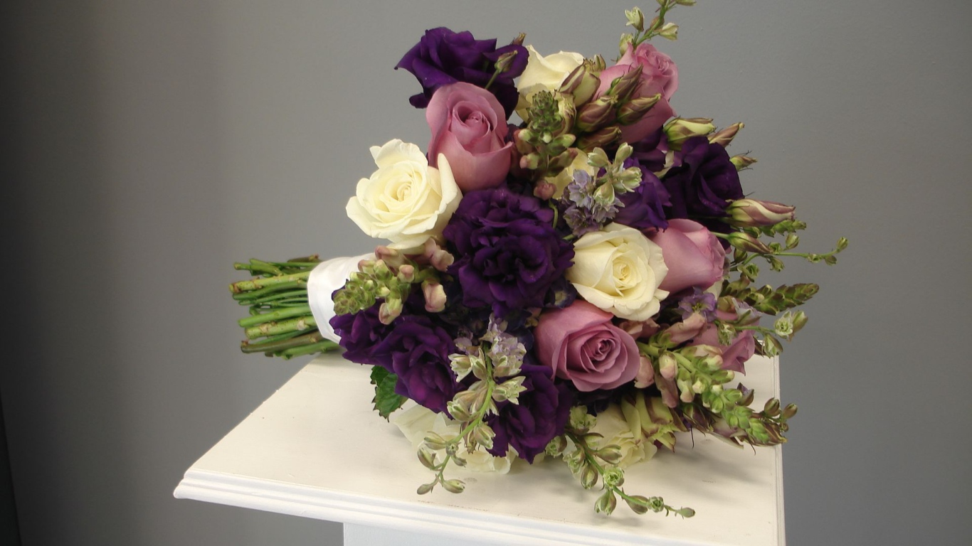 Purple roses in a beautiful wedding bouquet