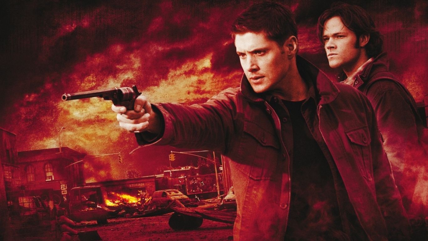 Dean aims a gun in the TV series Supernatural