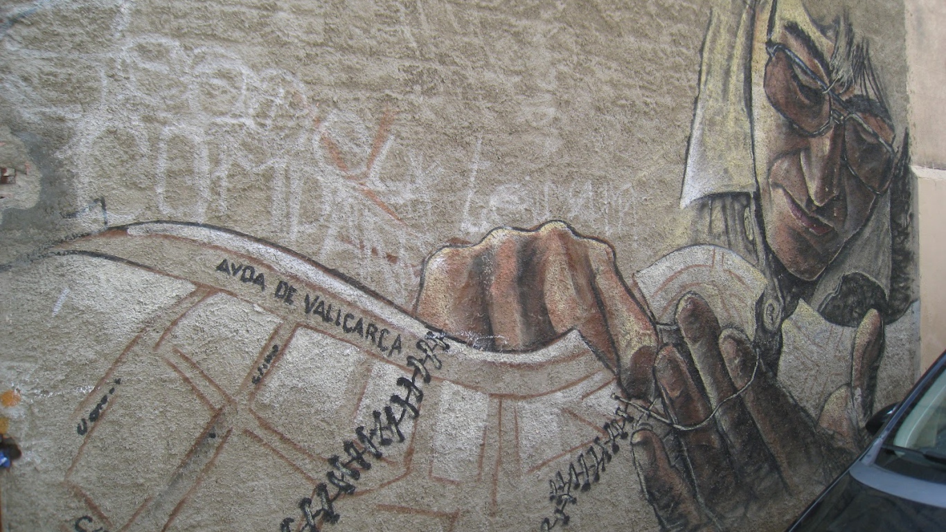 Рисунок мужчины в очках на стене