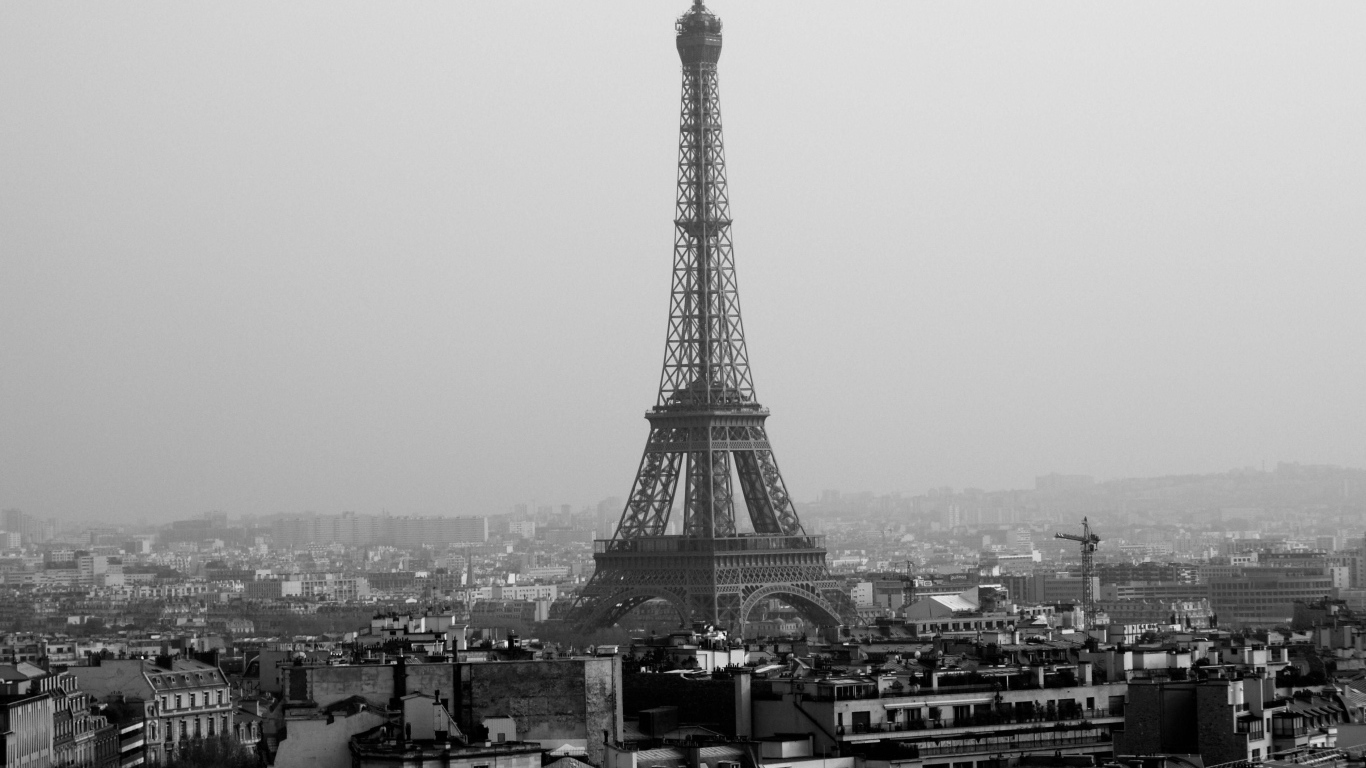 Old, black-and-white photo of the Eiffel Tower