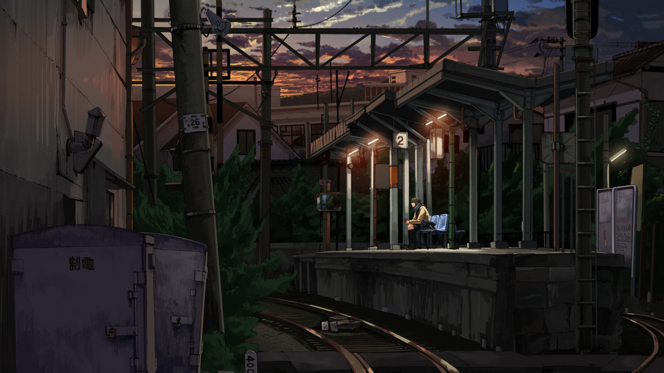 Одинокий парень на железнодорожной станции