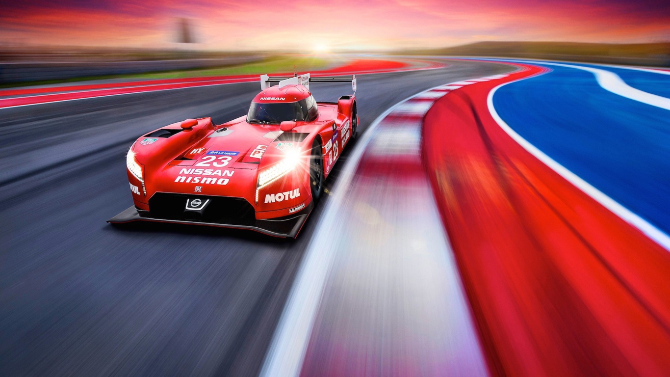 Красный гоночный автомобиль на треке