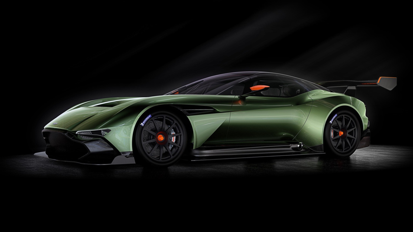 Зеленый спортивный Aston Martin на черном фоне