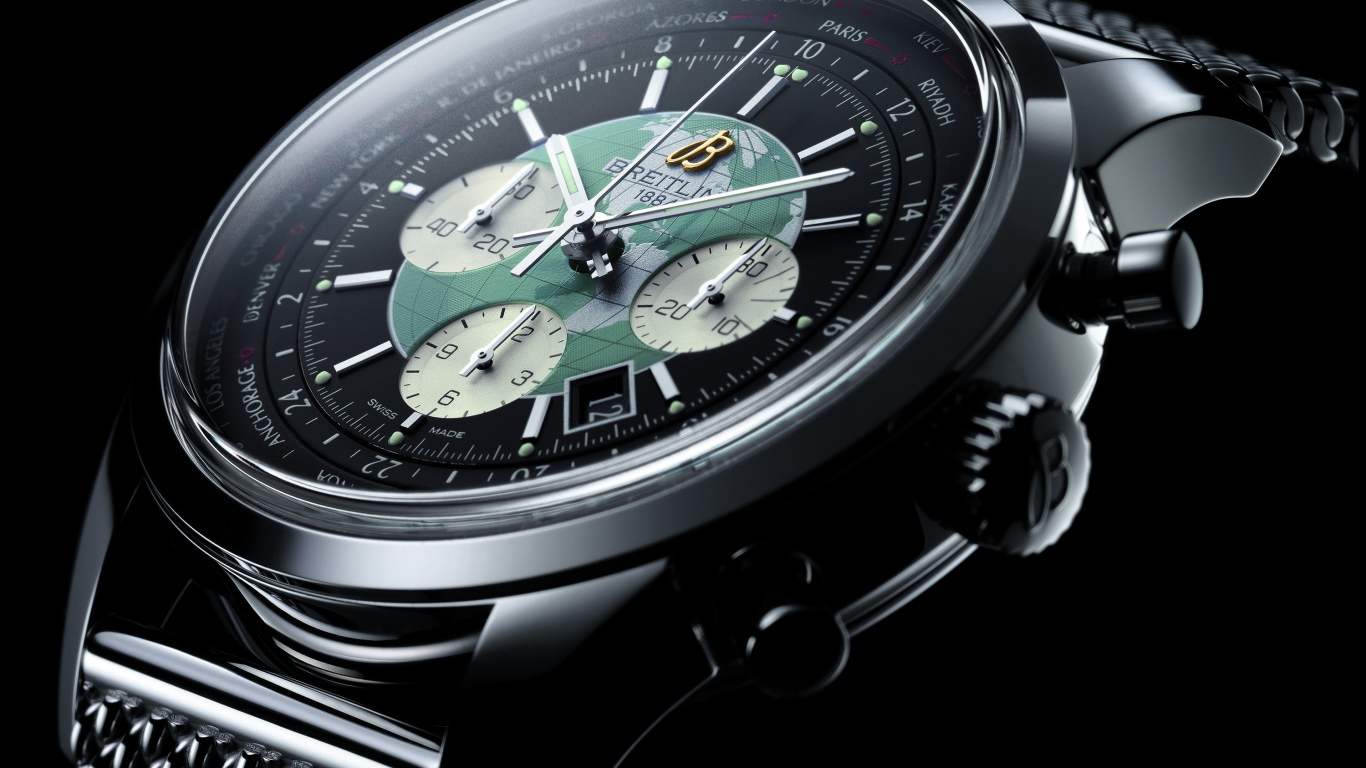 Дорогие наручные часы с картой мира на циферблате