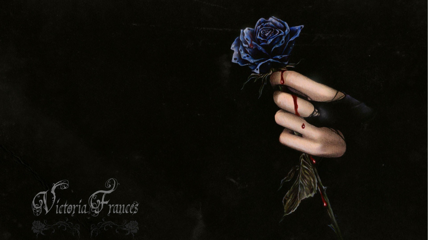 Капли крови на розе и руке