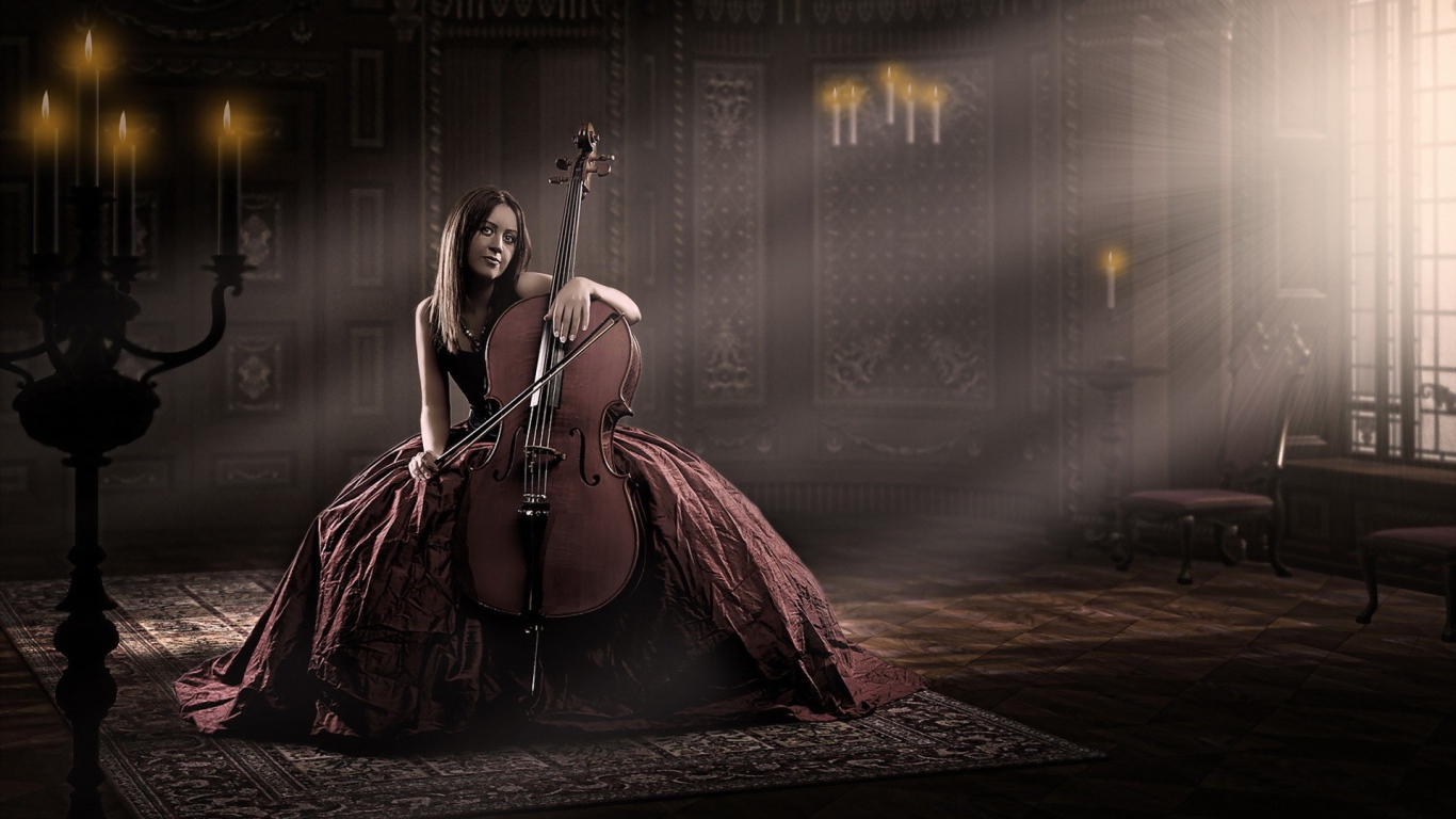 Девушка в роскошном платье играет на виолончели