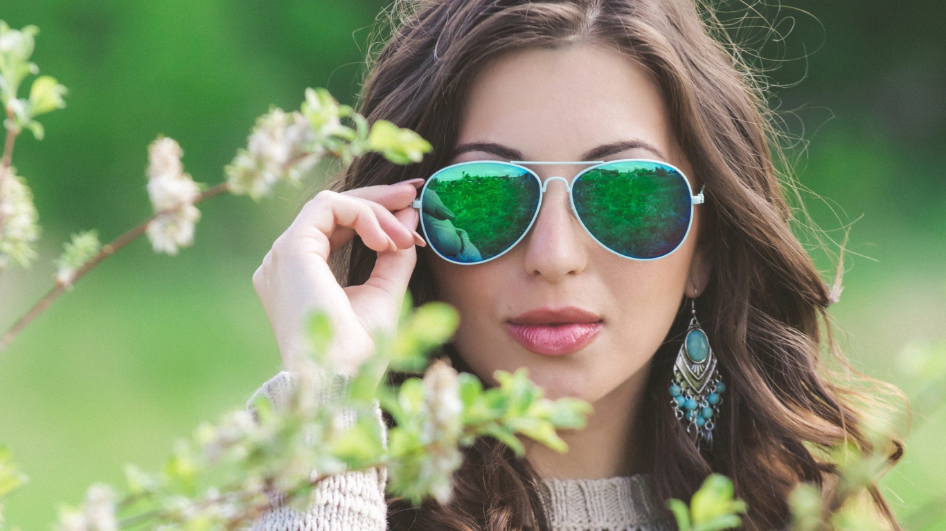 Green reflection of a girl with glasses