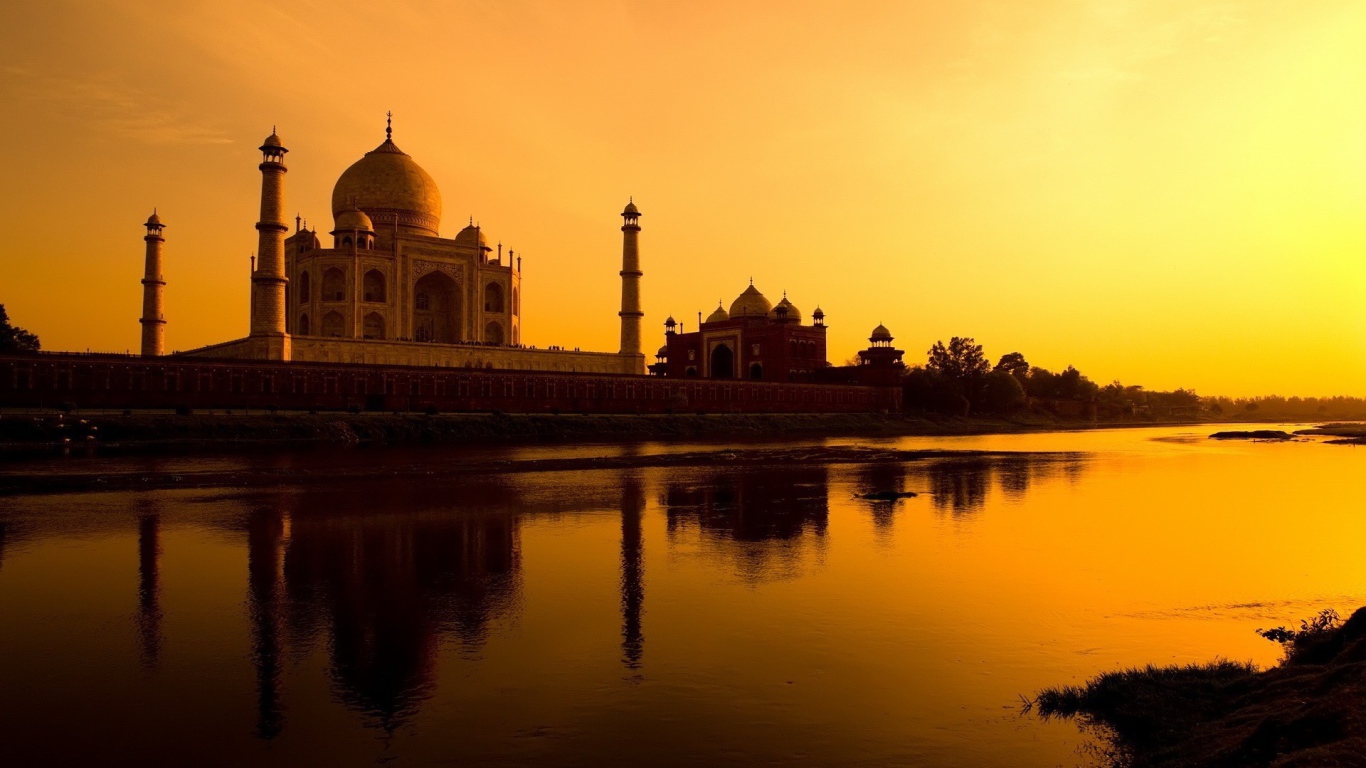 River at the foot of the Taj Mahal at sunset