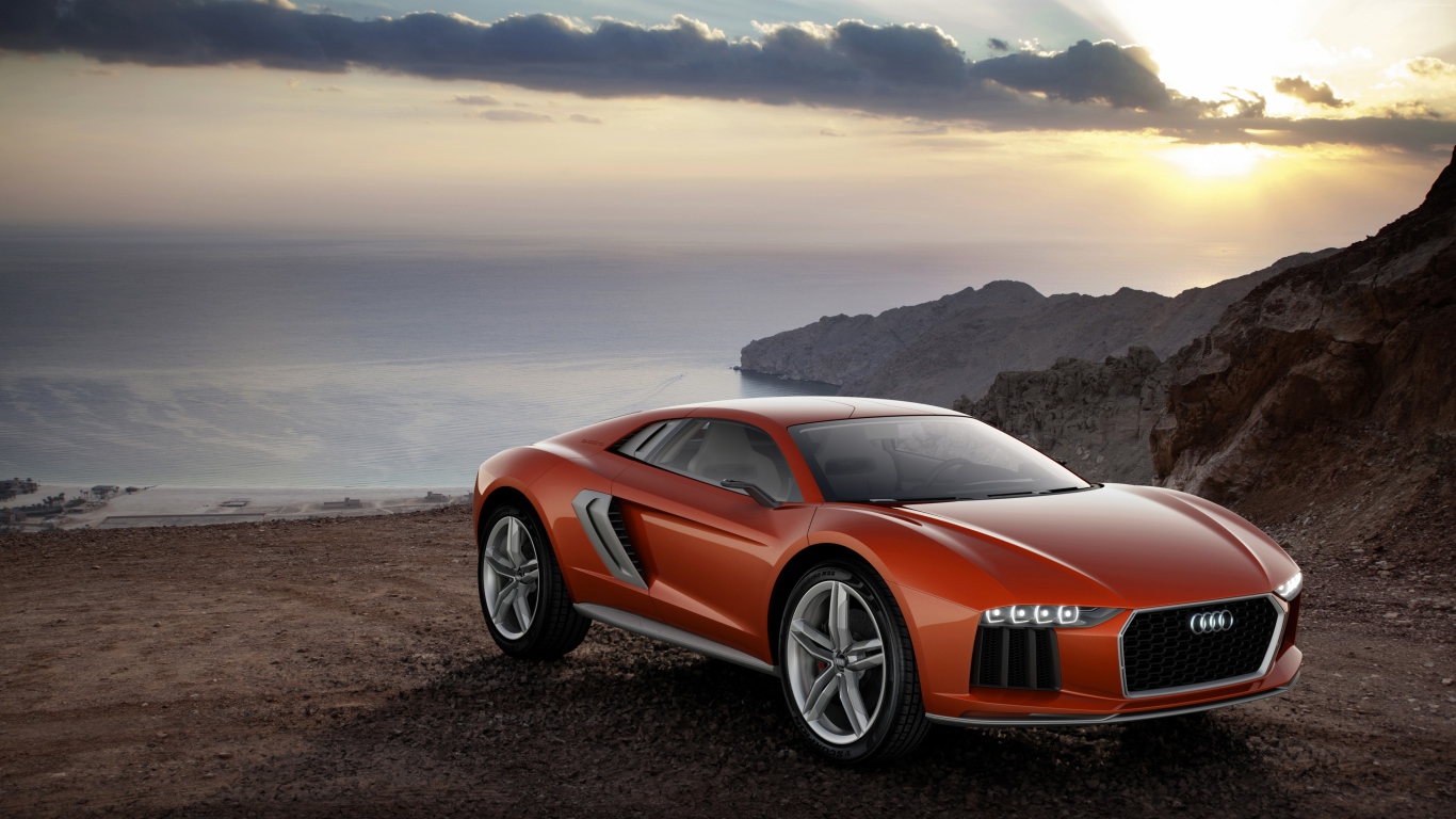 Оранжевый суперкар Audi Nanuk Quattro на фоне океана
