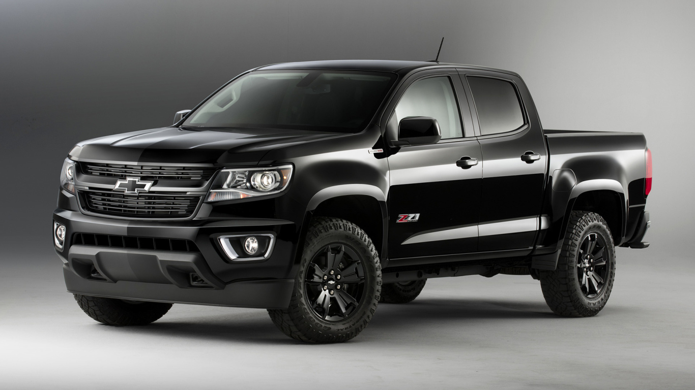 Черный автомобиль пикап Chevrolet Colorado на сером фоне