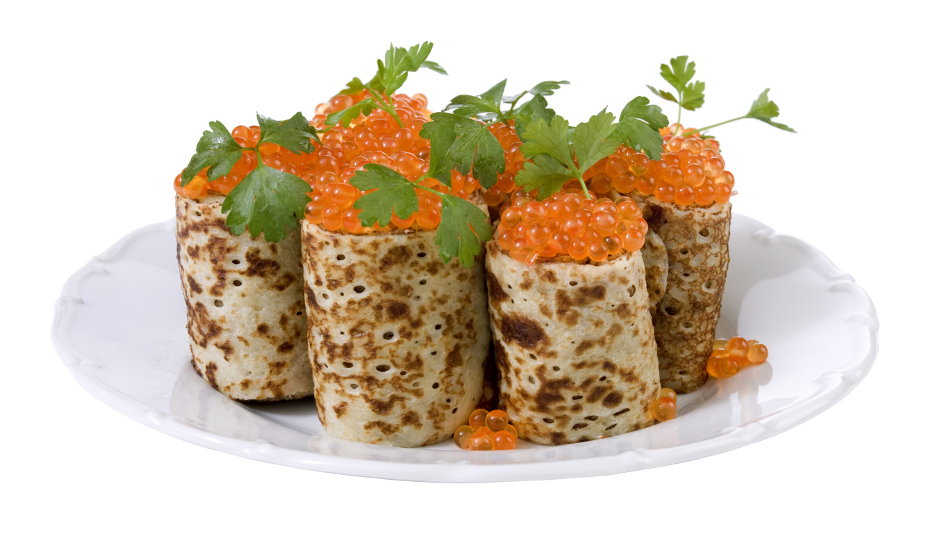 Роллы из блинов с красной икрой на белом блюде