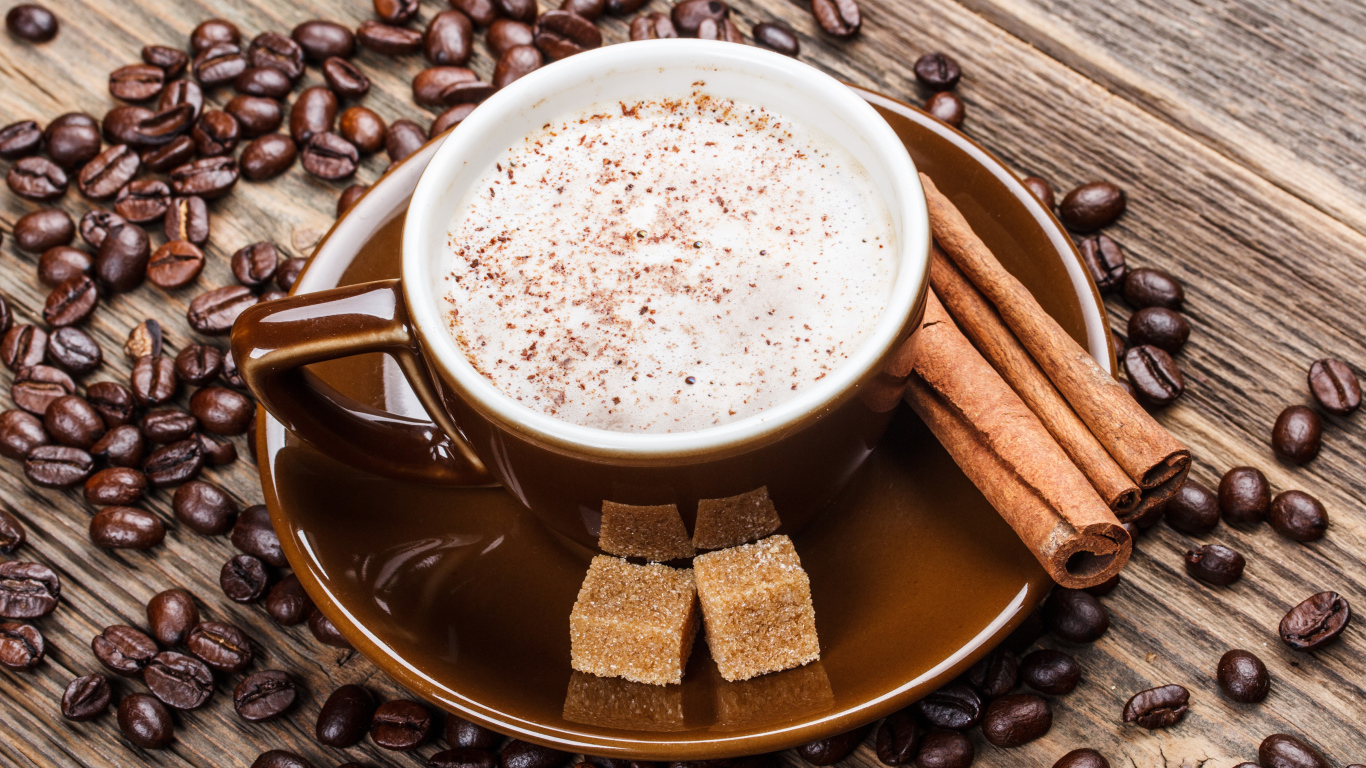 Кофе в коричневой чашке с корицей и сахаром 