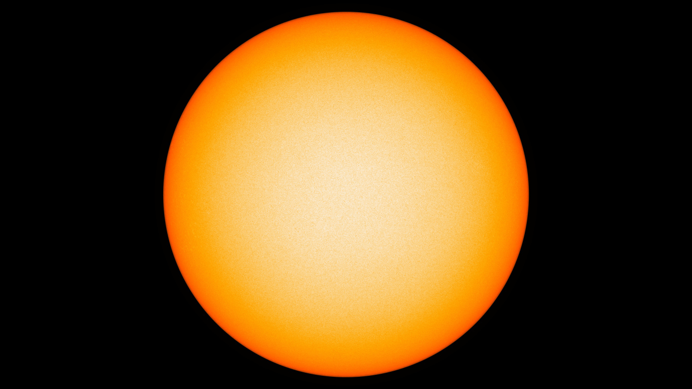 Яркое желтое солнце на черном фоне