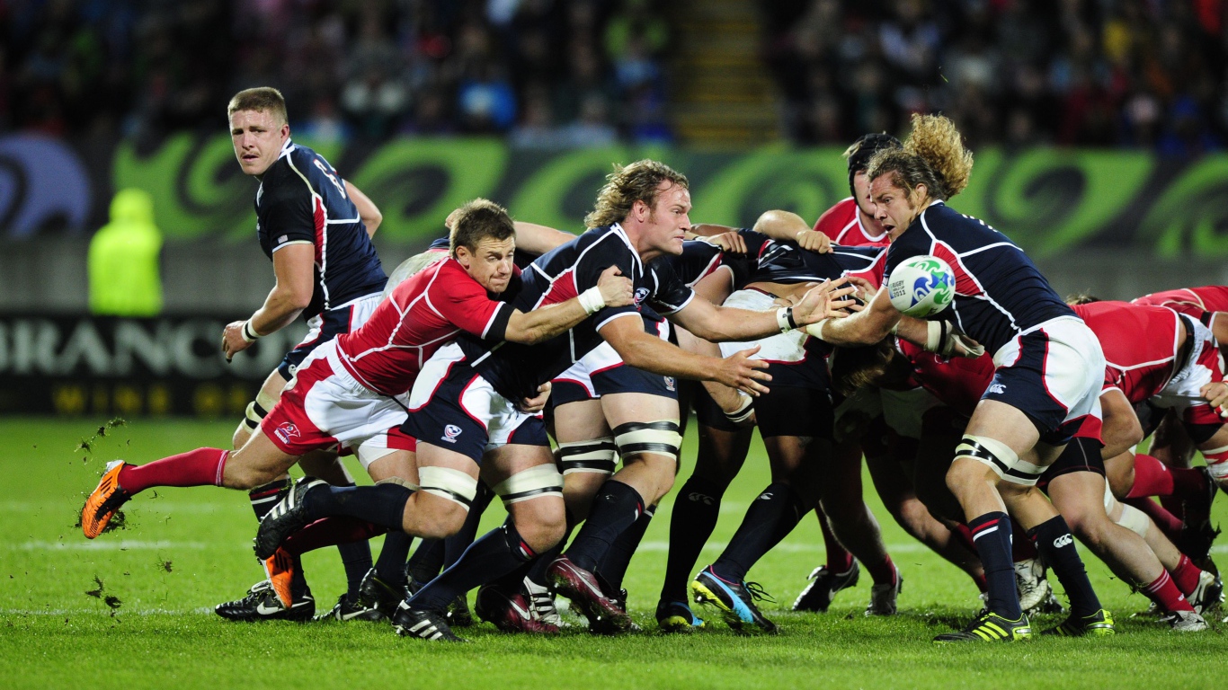 Борьба команд по регби на поле 