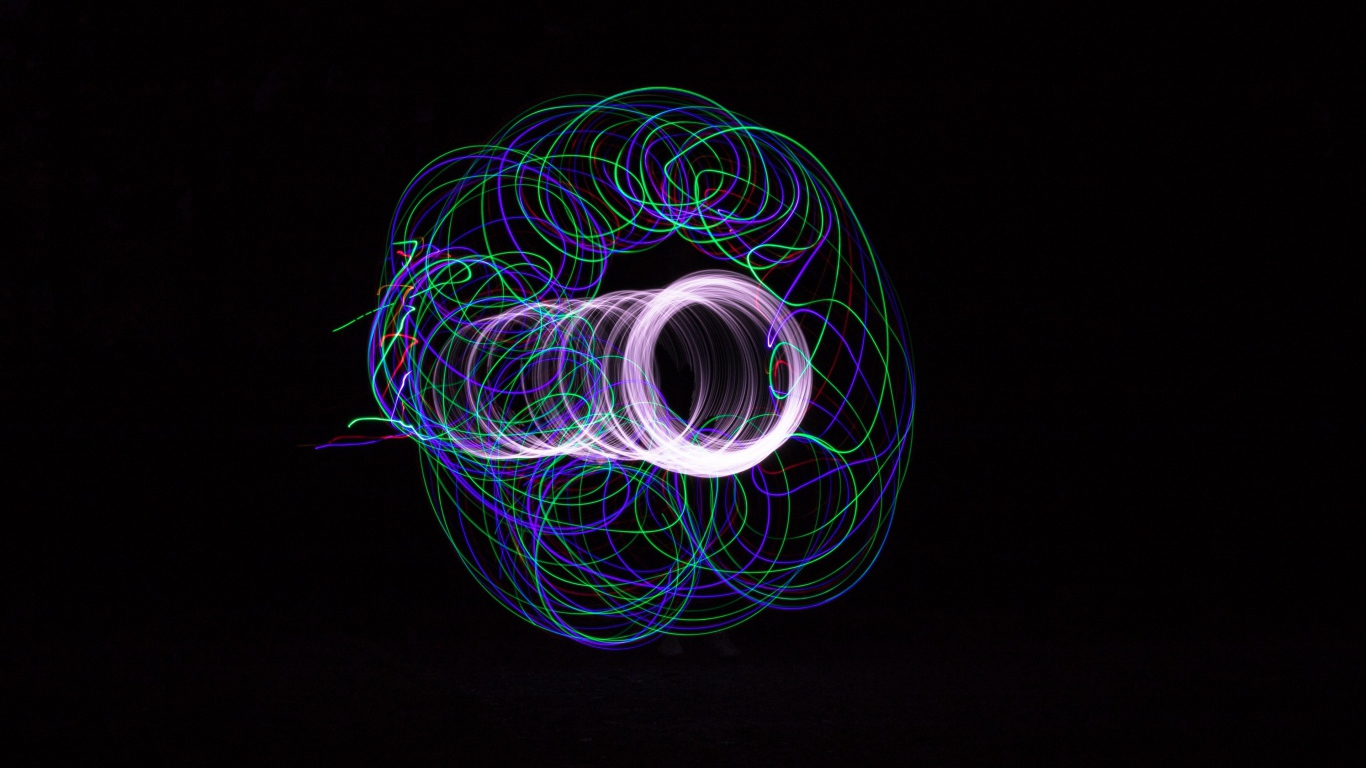 Multicolored neon circles on a black background