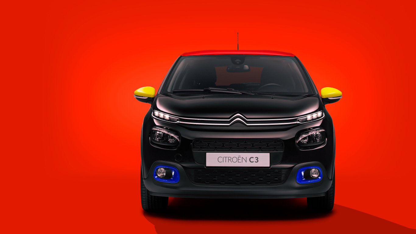 Черный автомобиль Citroen C3 JCC на красном фоне